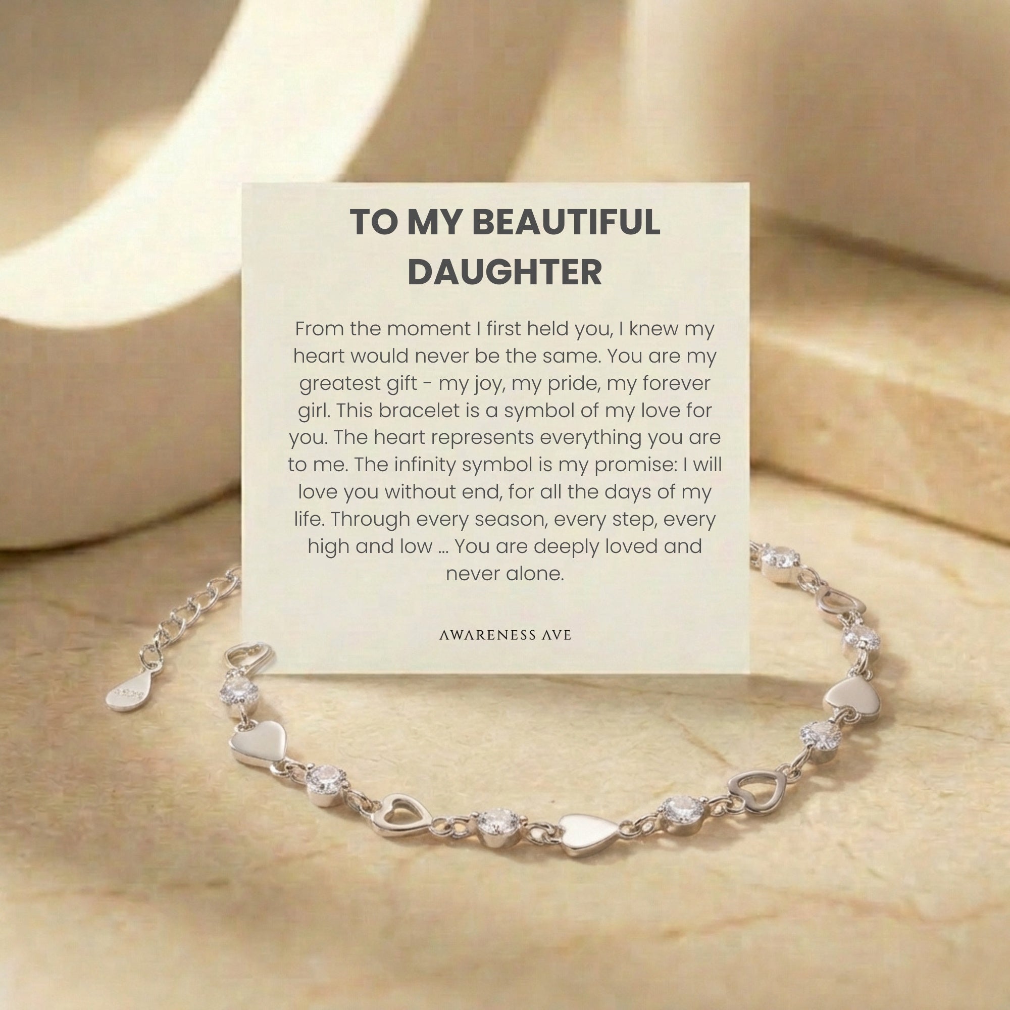 The 'Cherished Daughter' solid gold bracelet with a heart and infinity design