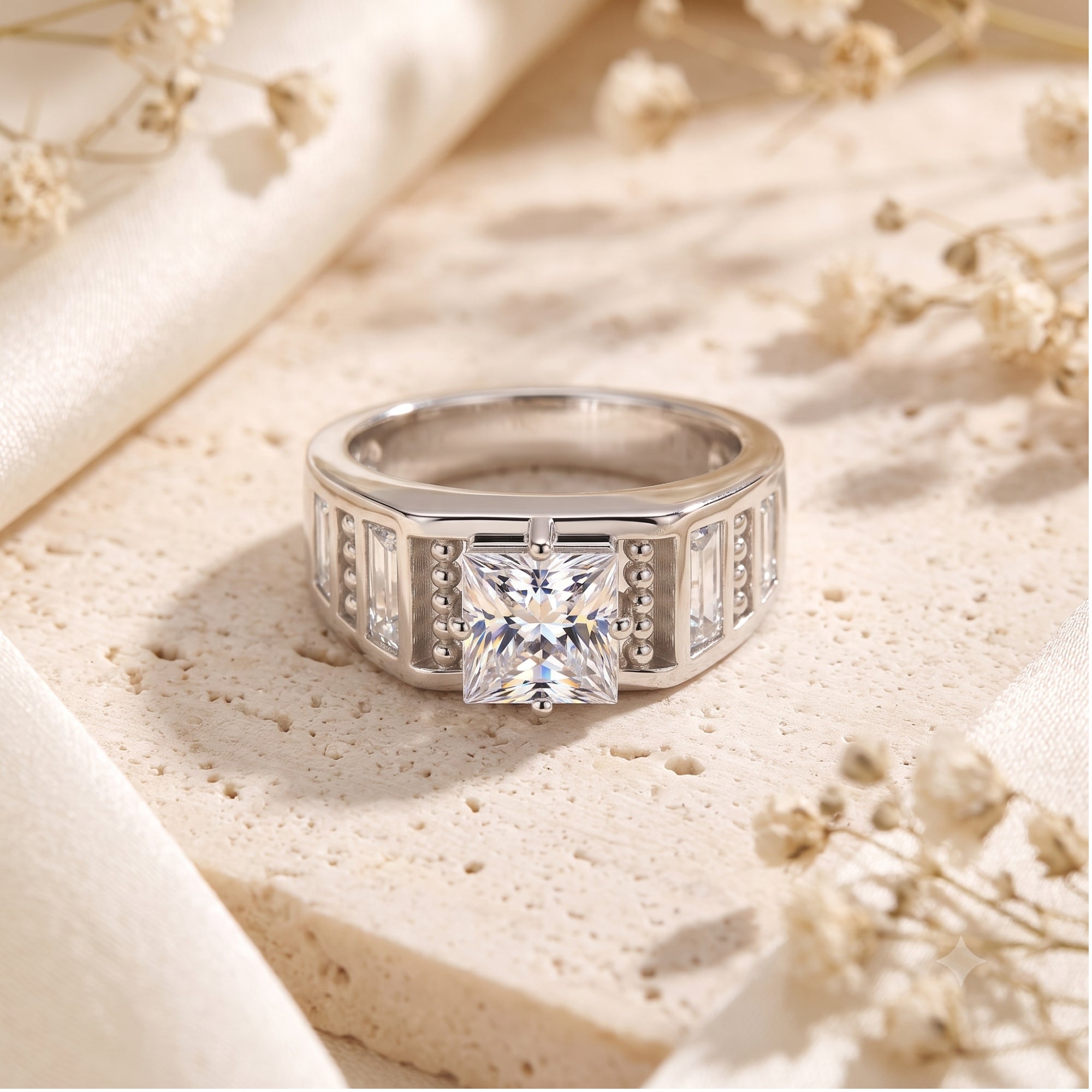 Front view of the Carisara princess cut simulated diamond ring in S925 sterling silver on a stone surface.