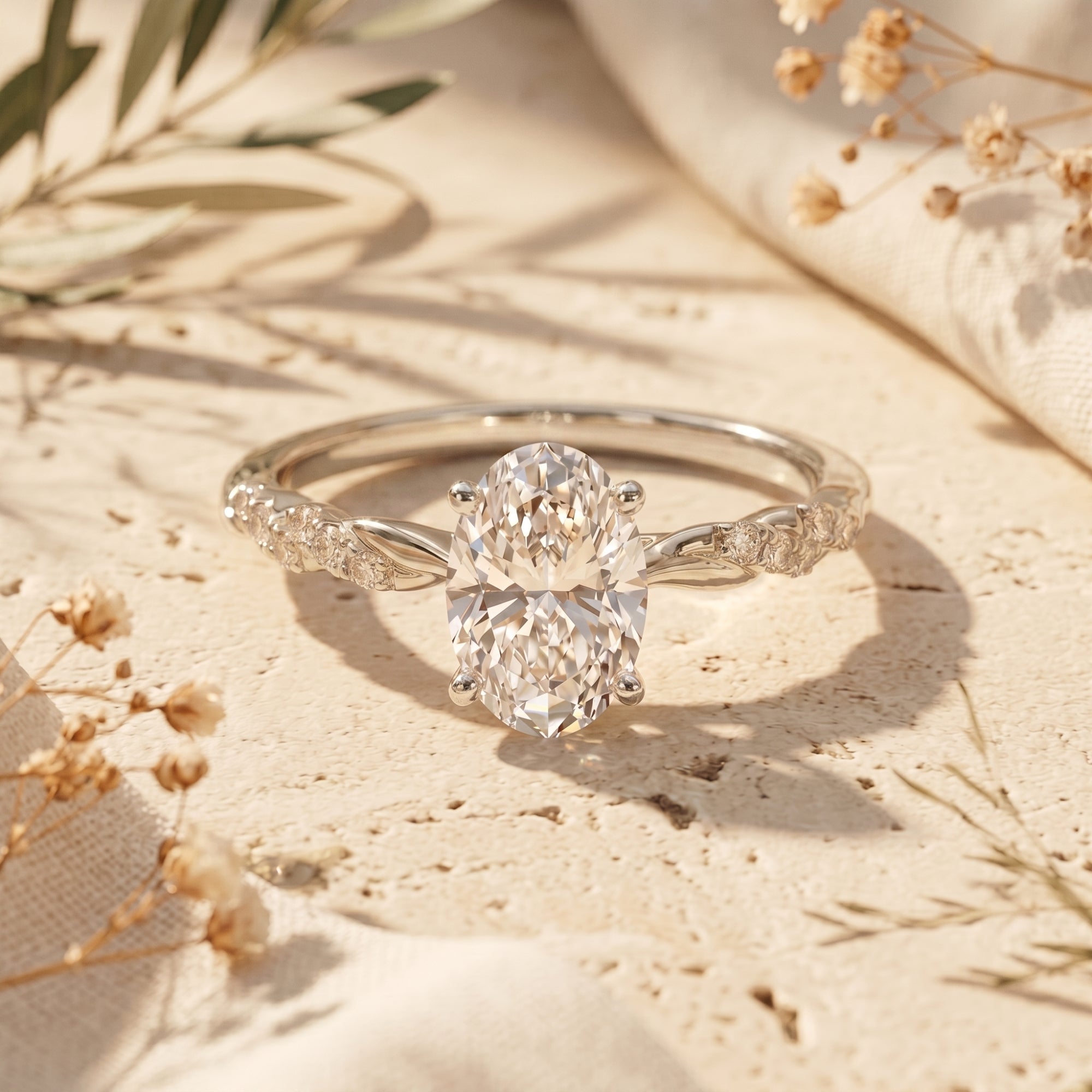 Silver oval moissanite ring with twisted band on stone.