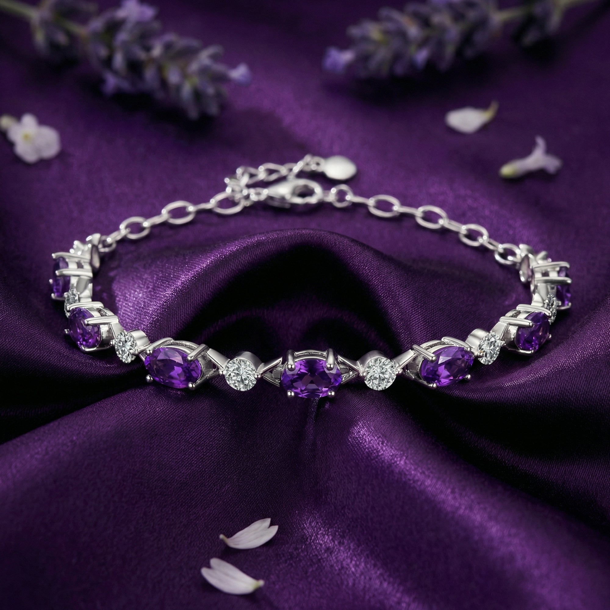 Verona S925 sterling silver station bracelet with seven oval amethyst gemstones on purple silk with lavender.