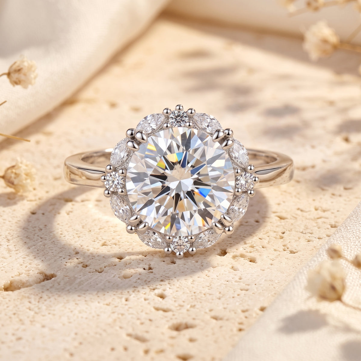 Front view of the silver Sunburst Halo Ring with a large round central stone surrounded by a detailed halo.