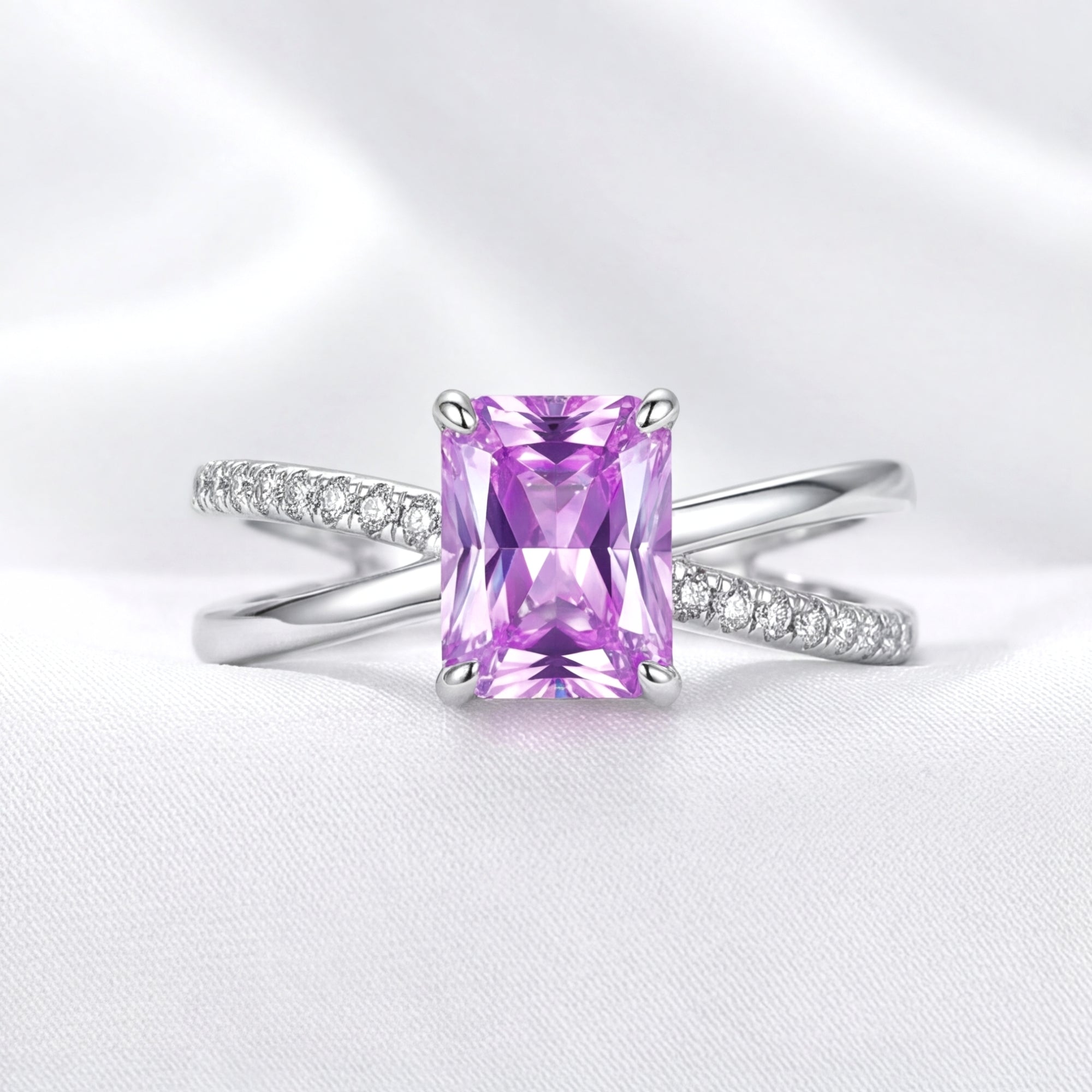 Front view of the emerald-cut simulated amethyst Evanthe ring in S925 sterling silver with pavé on white silk.