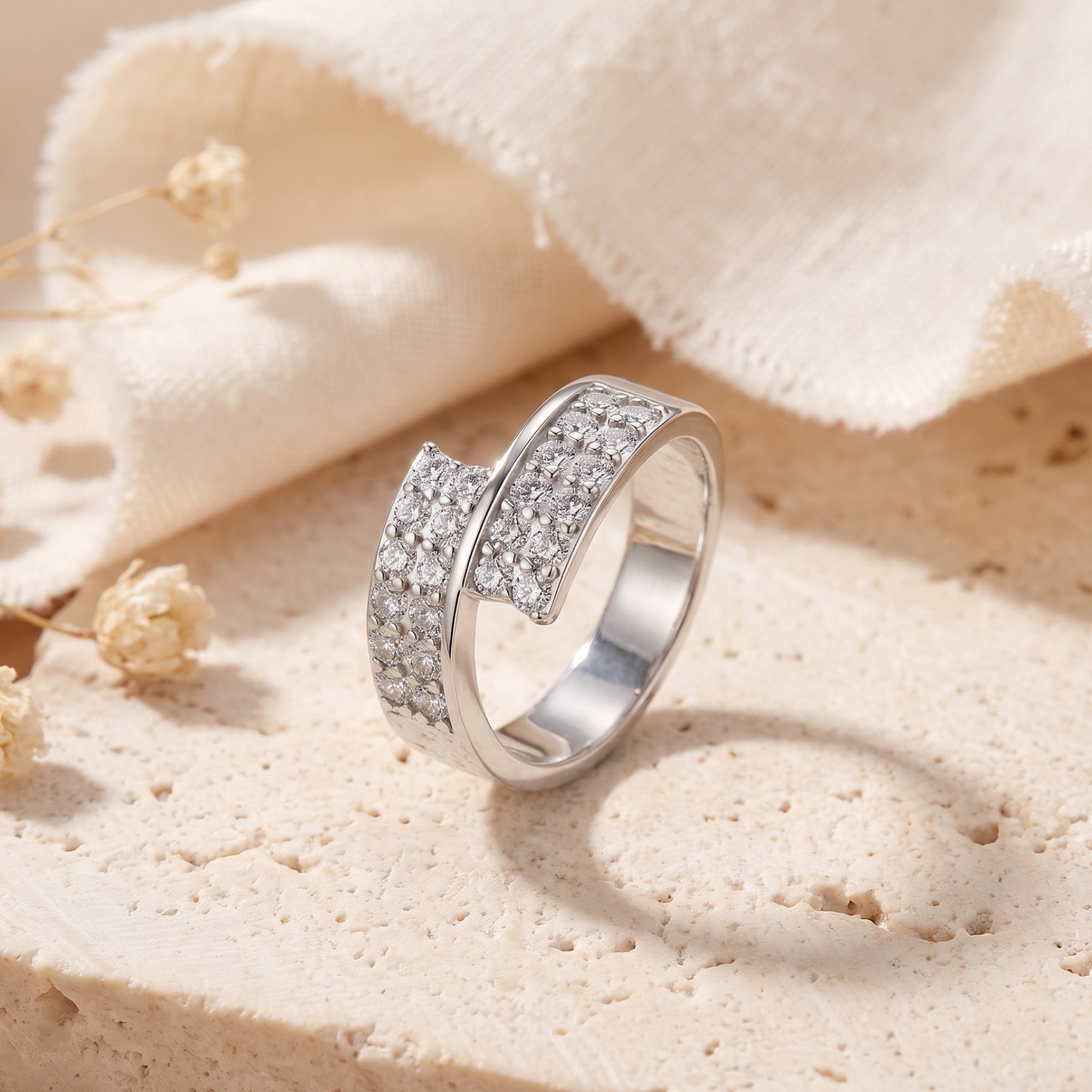 Angled view of the S925 sterling silver Eldria bypass promise ring with round simulated diamonds on stone.