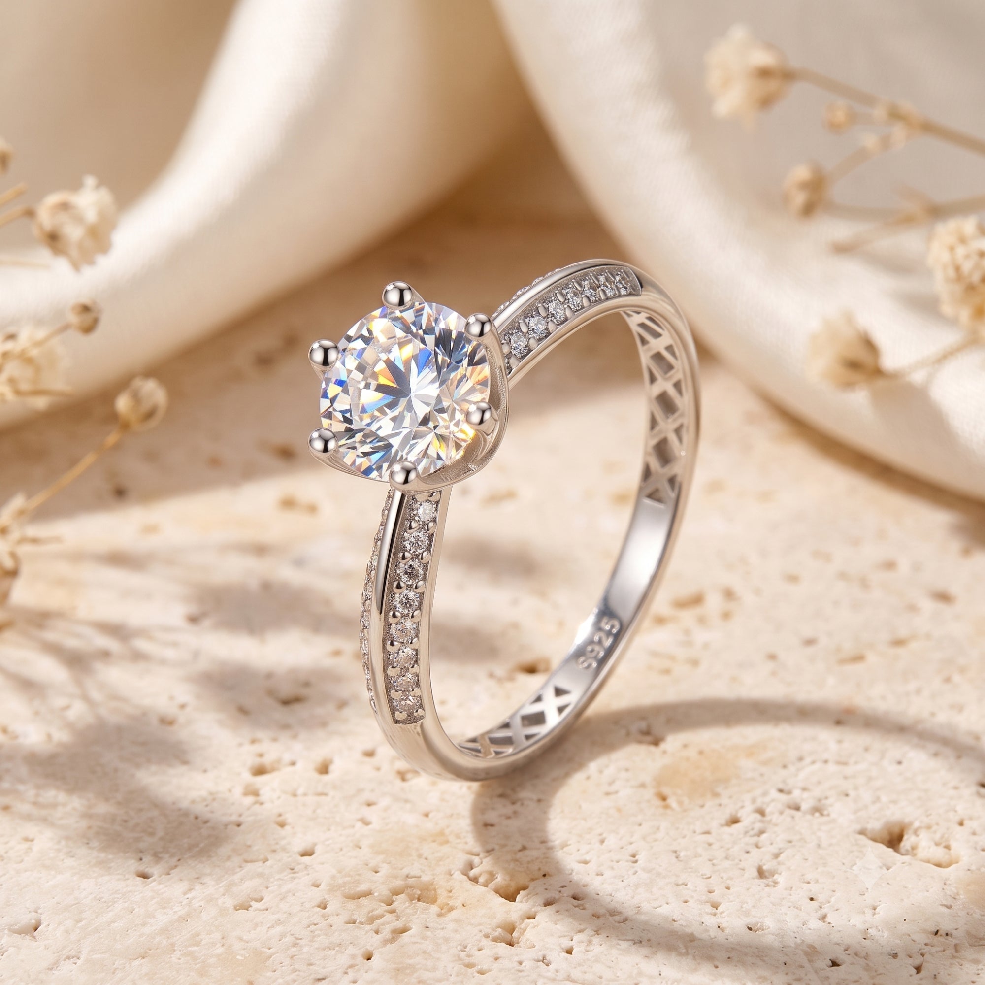 Cassidienne S925 silver solitaire ring with round simulated diamond on a lifestyle background.