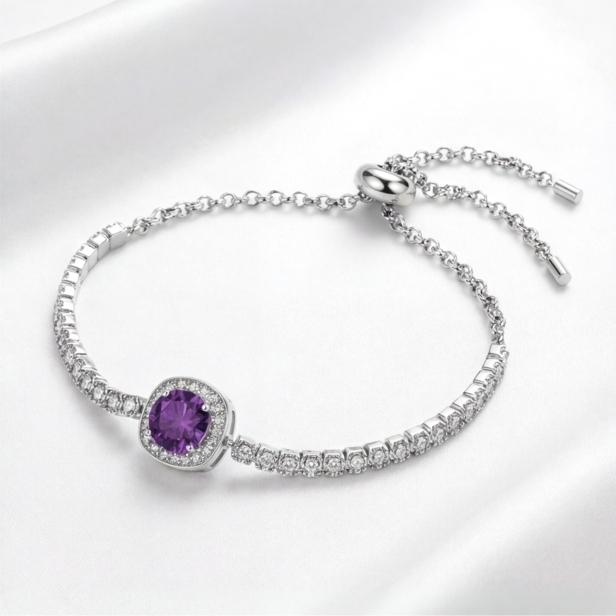 Round cut purple simulated amethyst halo bracelet in S925 sterling silver on a white silk background.