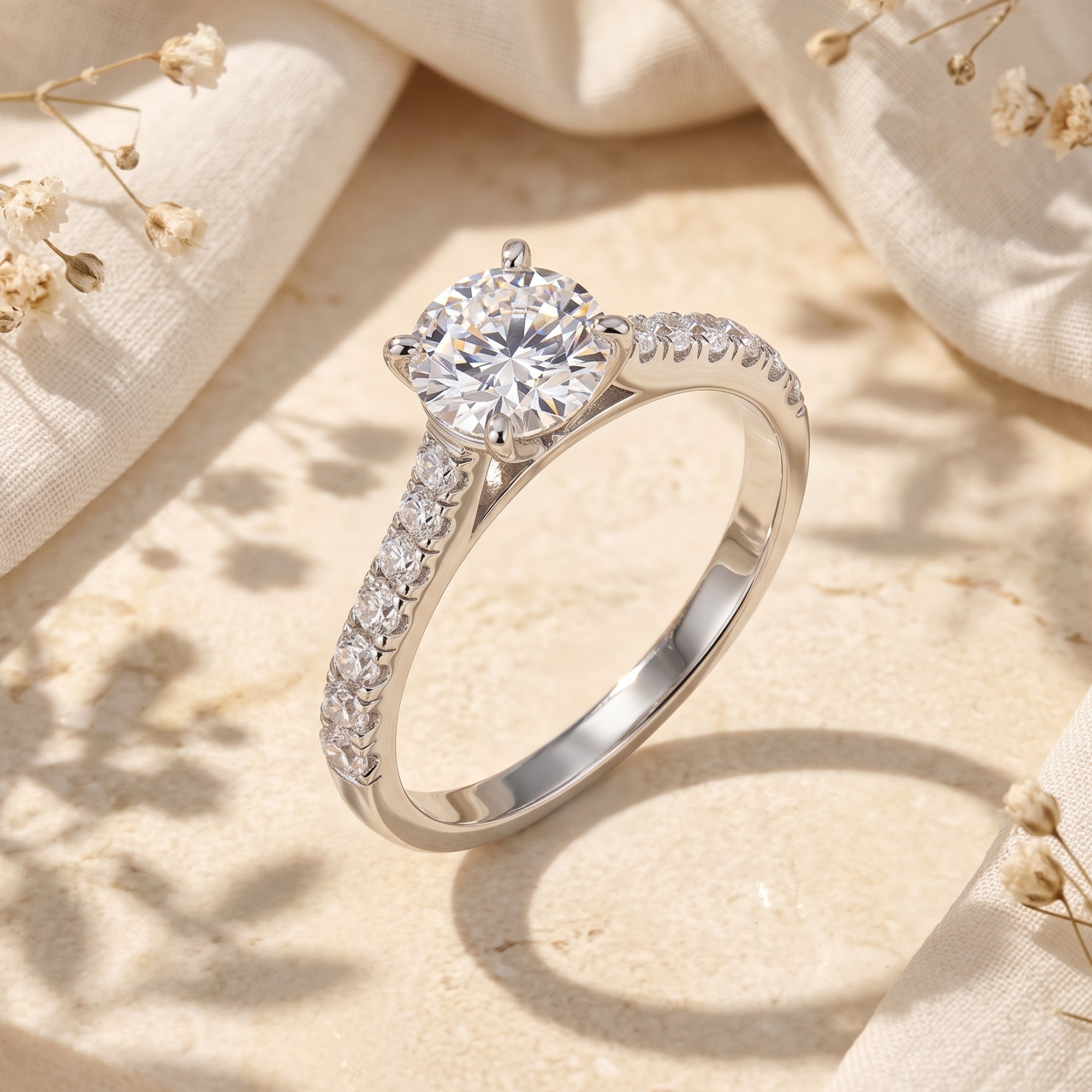 Round cut simulated diamond ring in sterling silver on a lifestyle background.