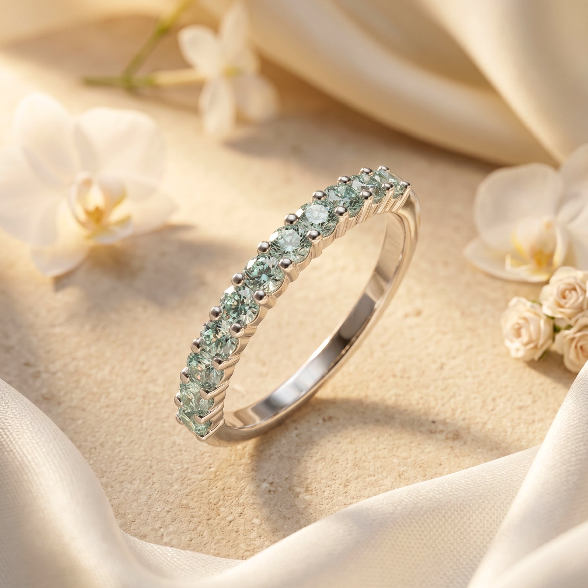 Fiorina sterling silver ring with round simulated alexandrite stones on a floral lifestyle background.