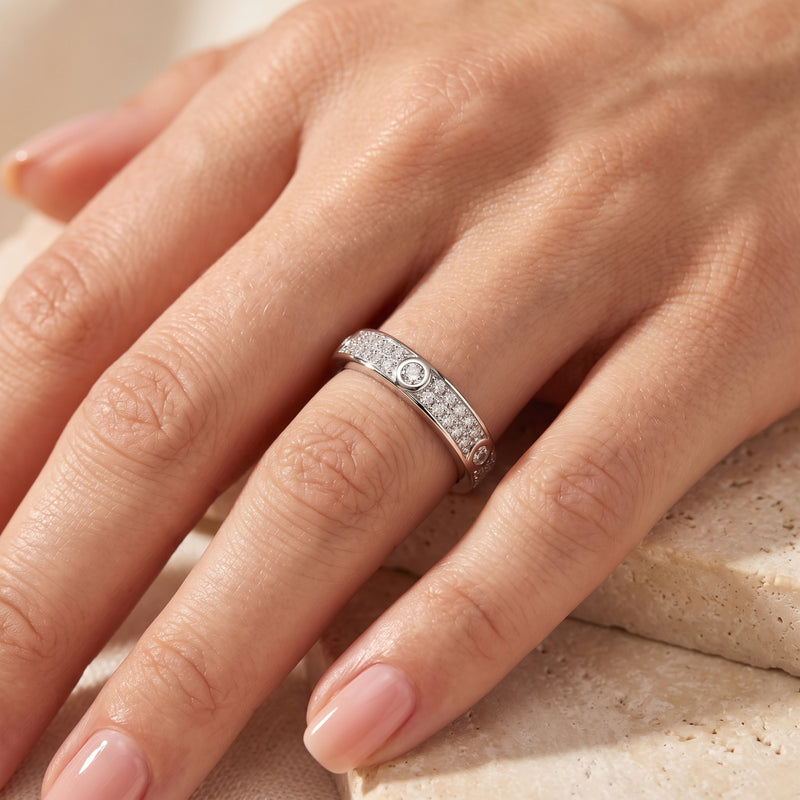Sterling silver simulated diamond promise ring worn on a model's ring finger.
