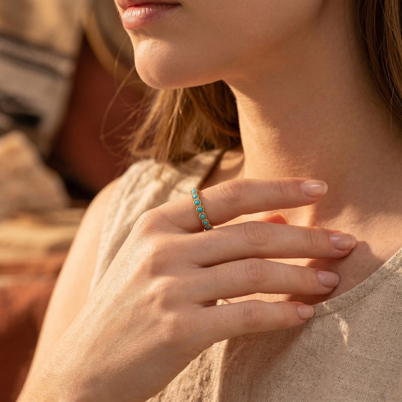 Model wearing the gold Zia turquoise eternity ring for a minimalist Southwestern-inspired look.