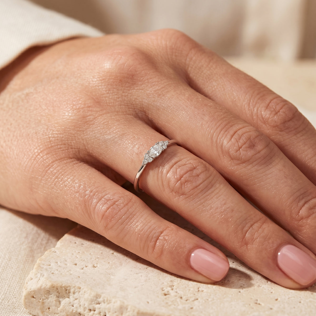 S925 sterling silver oval moissanite ring worn on a woman's finger.