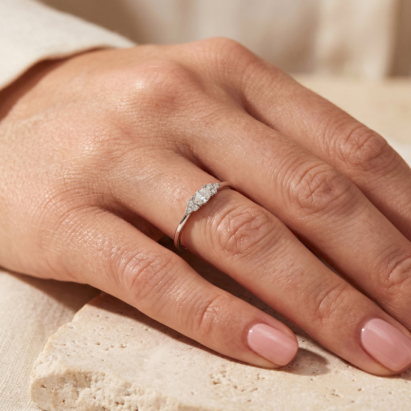 S925 sterling silver oval moissanite ring worn on a woman's finger.