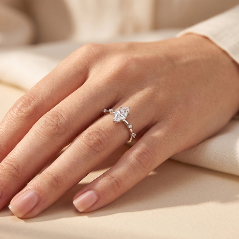 The Isabetta marquise cut simulated diamond promise ring in sterling silver worn on a model's ring finger.