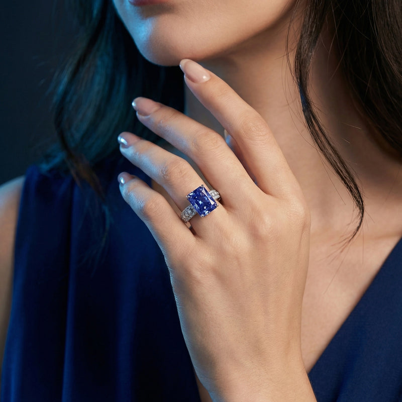 Model wearing the radiant cut natural tanzanite sterling silver ring on her finger.