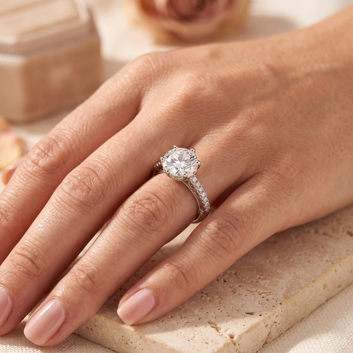 Sterling silver Kalisene ring with a 9mm round CZ solitaire worn on a woman's hand.