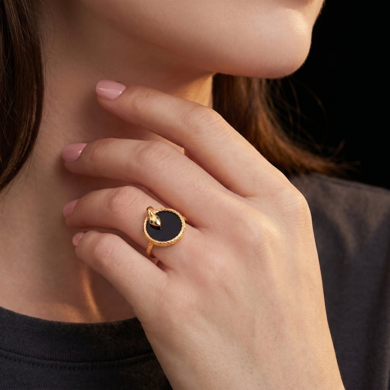 Model wearing the gold plated Regalia onyx snake ring on her finger.