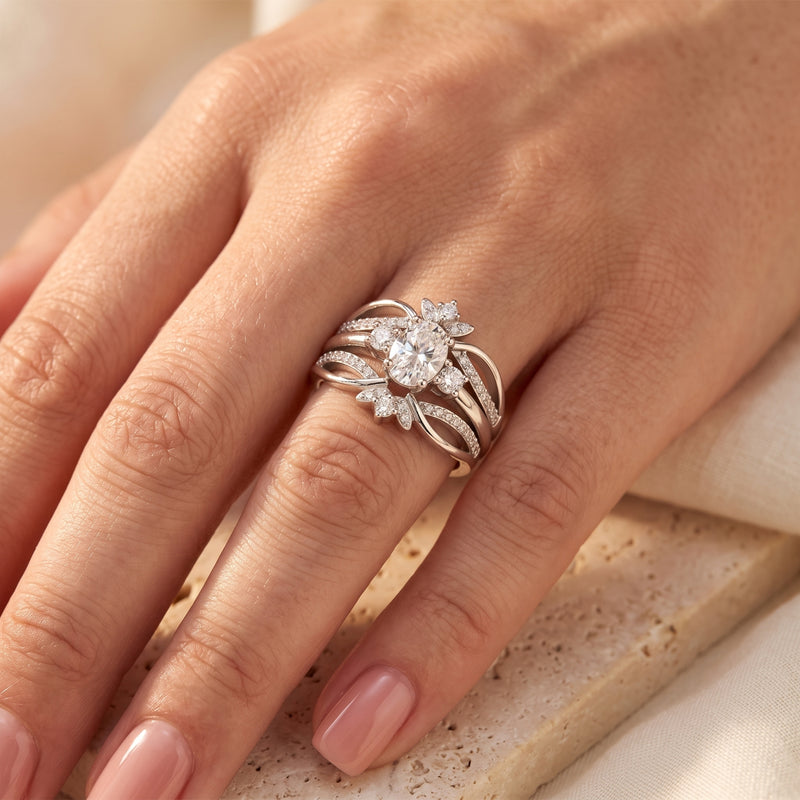 Sterling silver Philomene ring with oval simulated diamond worn on a woman's ring finger.