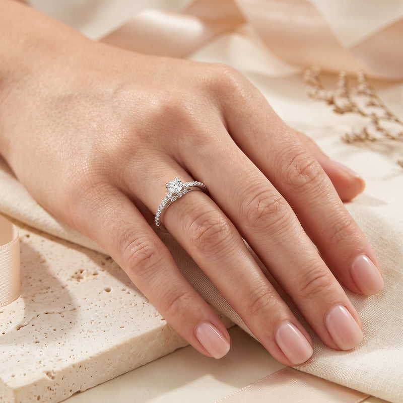 Round-cut simulated diamond Josephine ring in sterling silver worn on a model's hand.