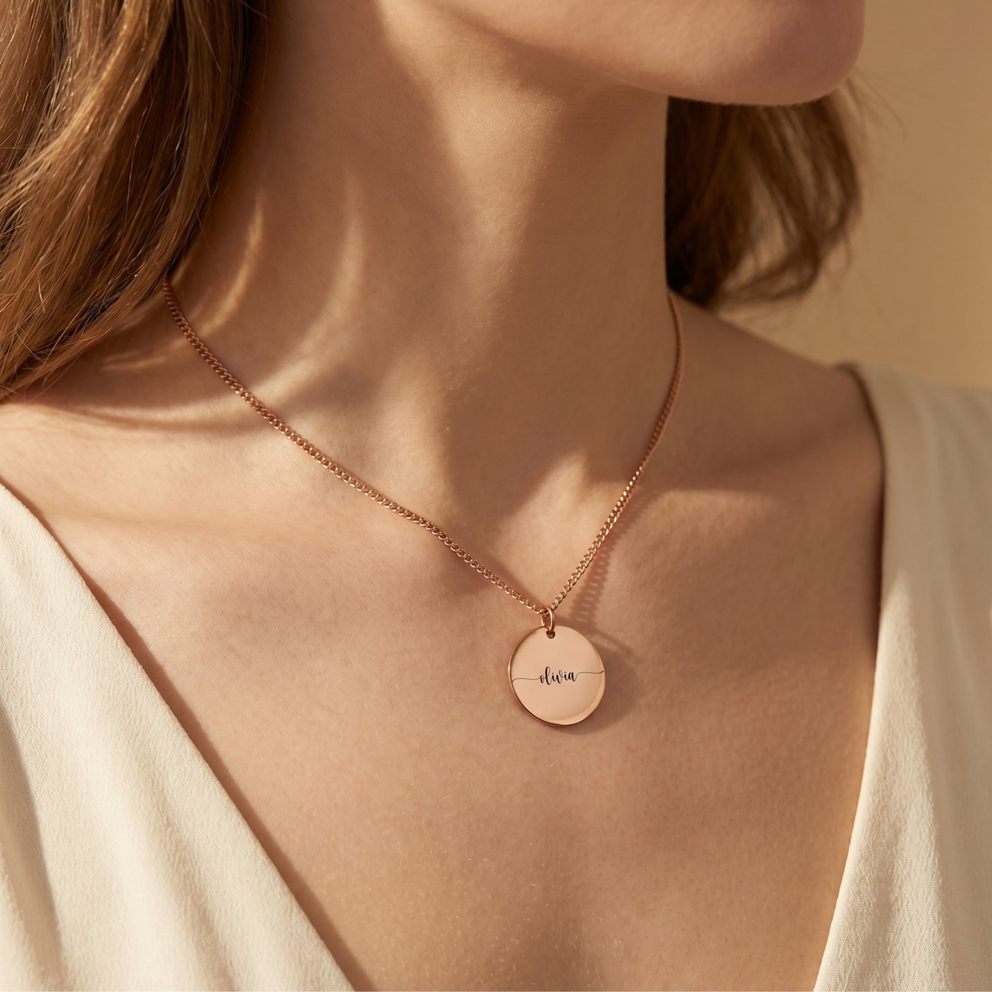 Eloise rose gold stainless steel personalized pendant worn by a model.