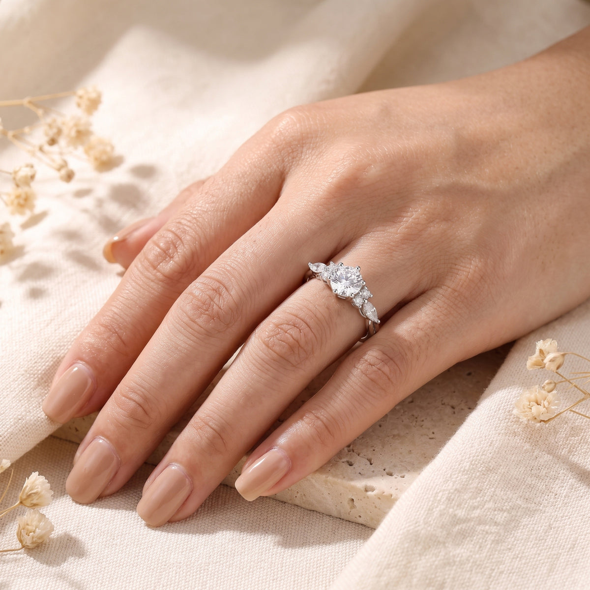 Sterling silver Claraluna promise ring with a round simulated diamond worn on a hand.