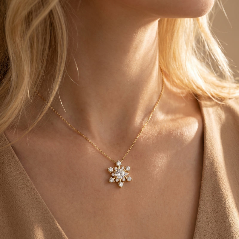 Model wearing the yellow gold moissanite snowflake necklace to show scale and fit.