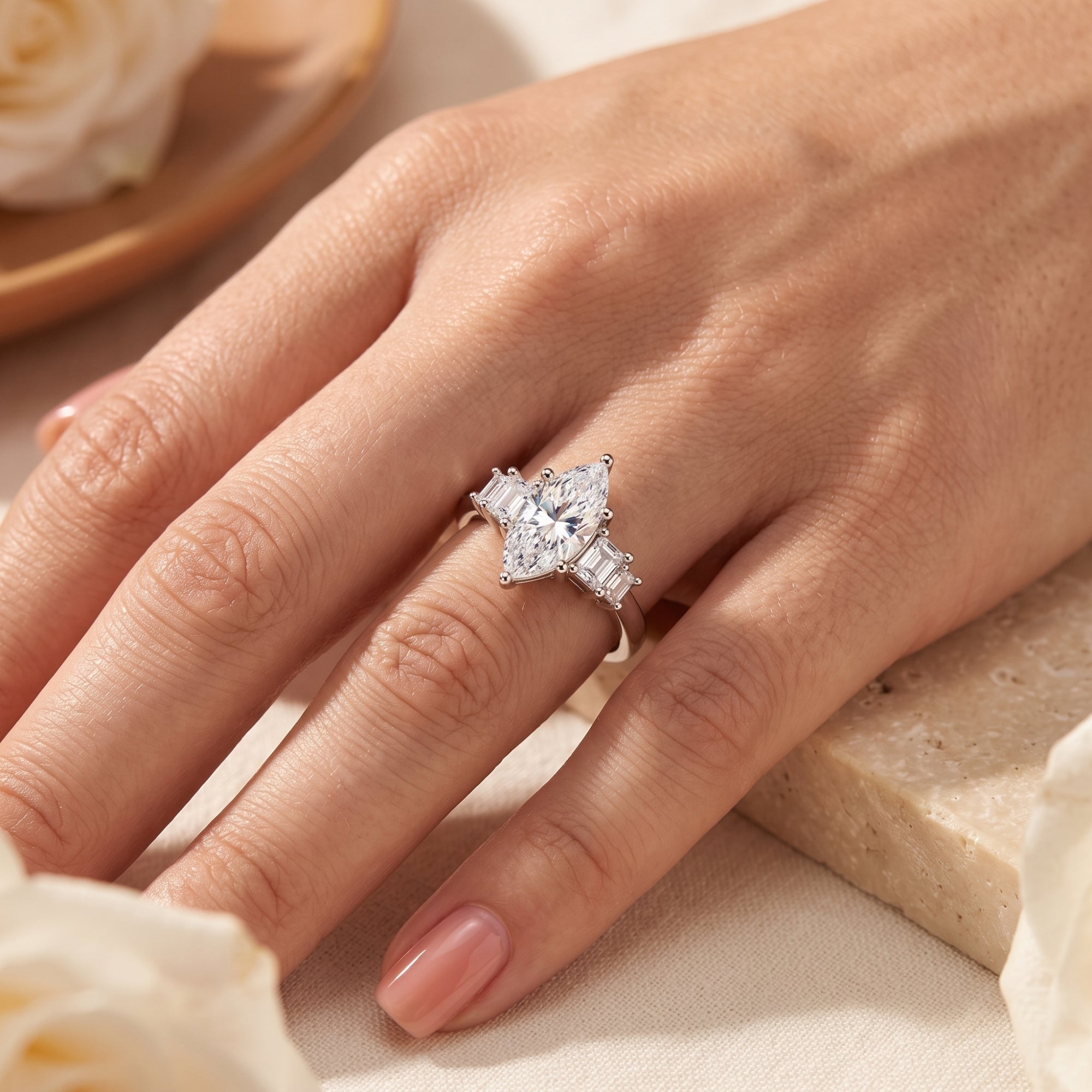 Sterling silver marquise-cut simulated diamond ring worn on a finger.