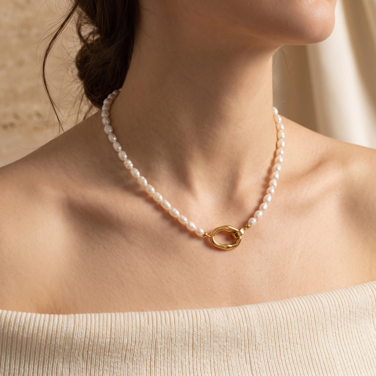 Model wearing Audrielle 18K gold PVD necklace with white rice pearls.