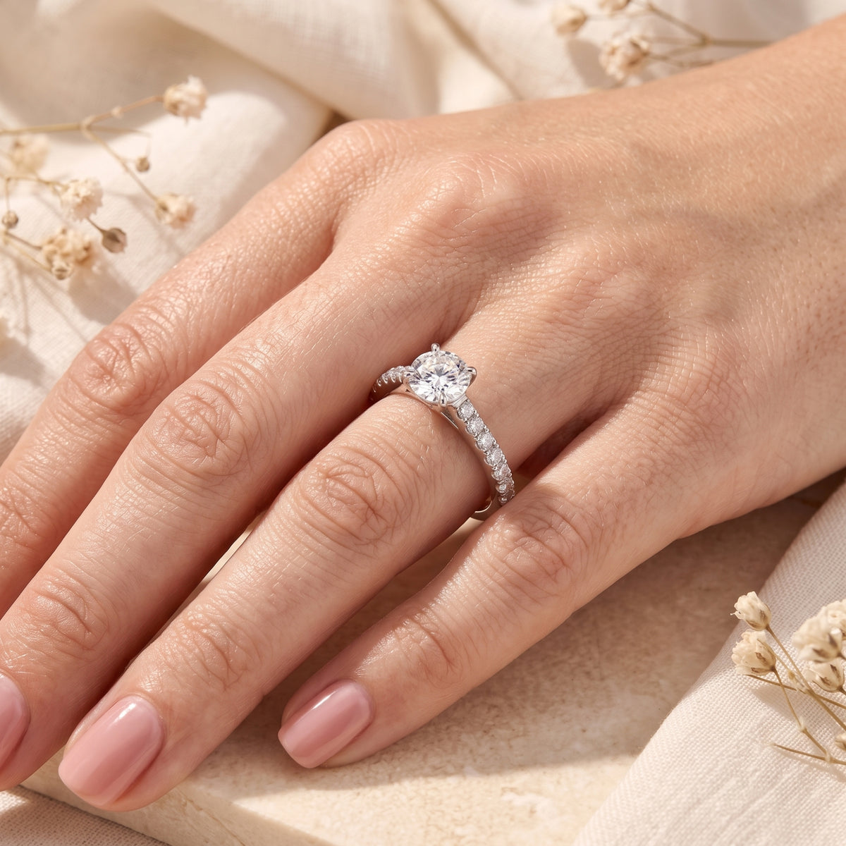 Sterling silver simulated diamond ring worn on a woman's hand.