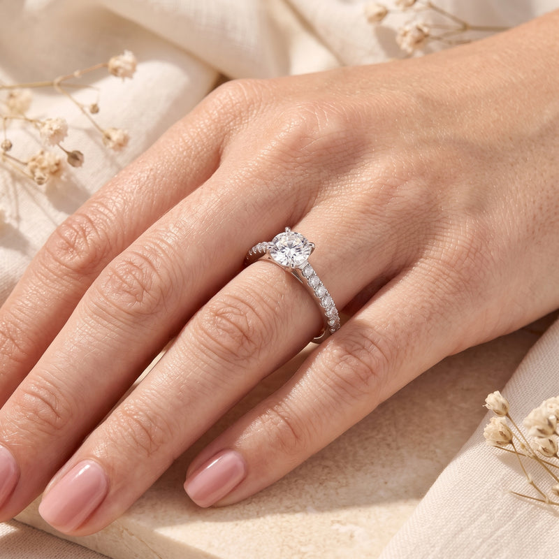 Sterling silver simulated diamond ring worn on a woman's hand.