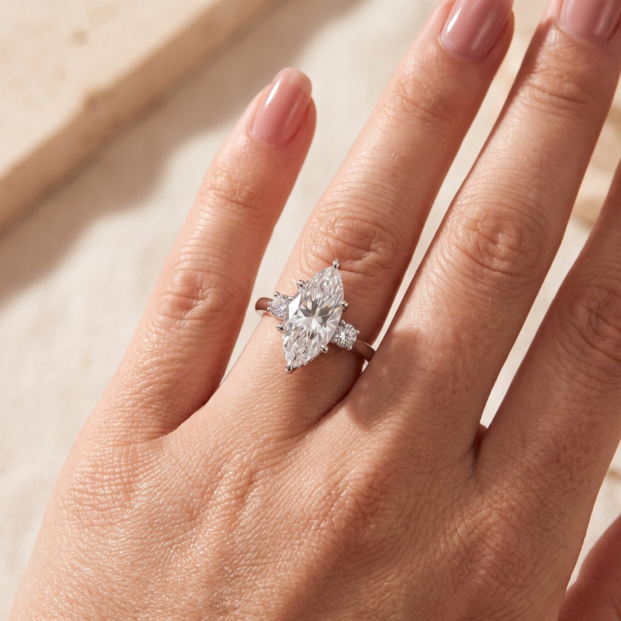 Sterling silver marquise simulated diamond ring worn on a finger.