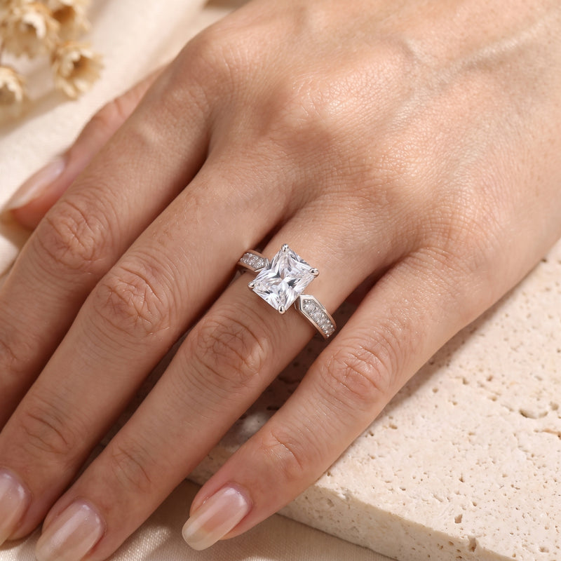 Radiant-cut simulated diamond sterling silver ring worn on a woman's hand.