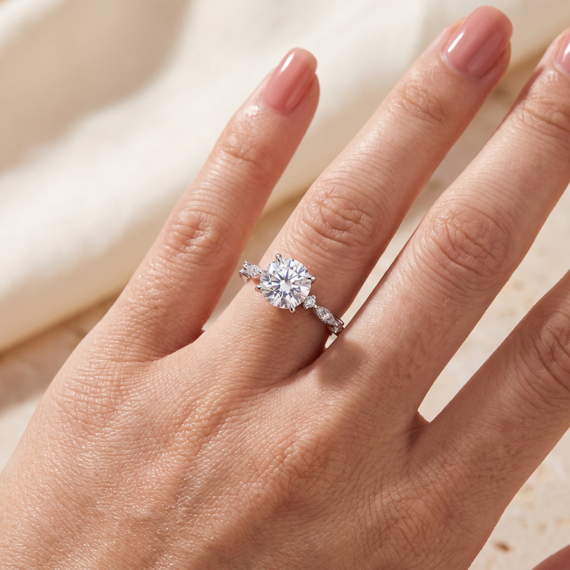 Sterling silver round-cut simulated diamond promise ring worn on a woman's hand.