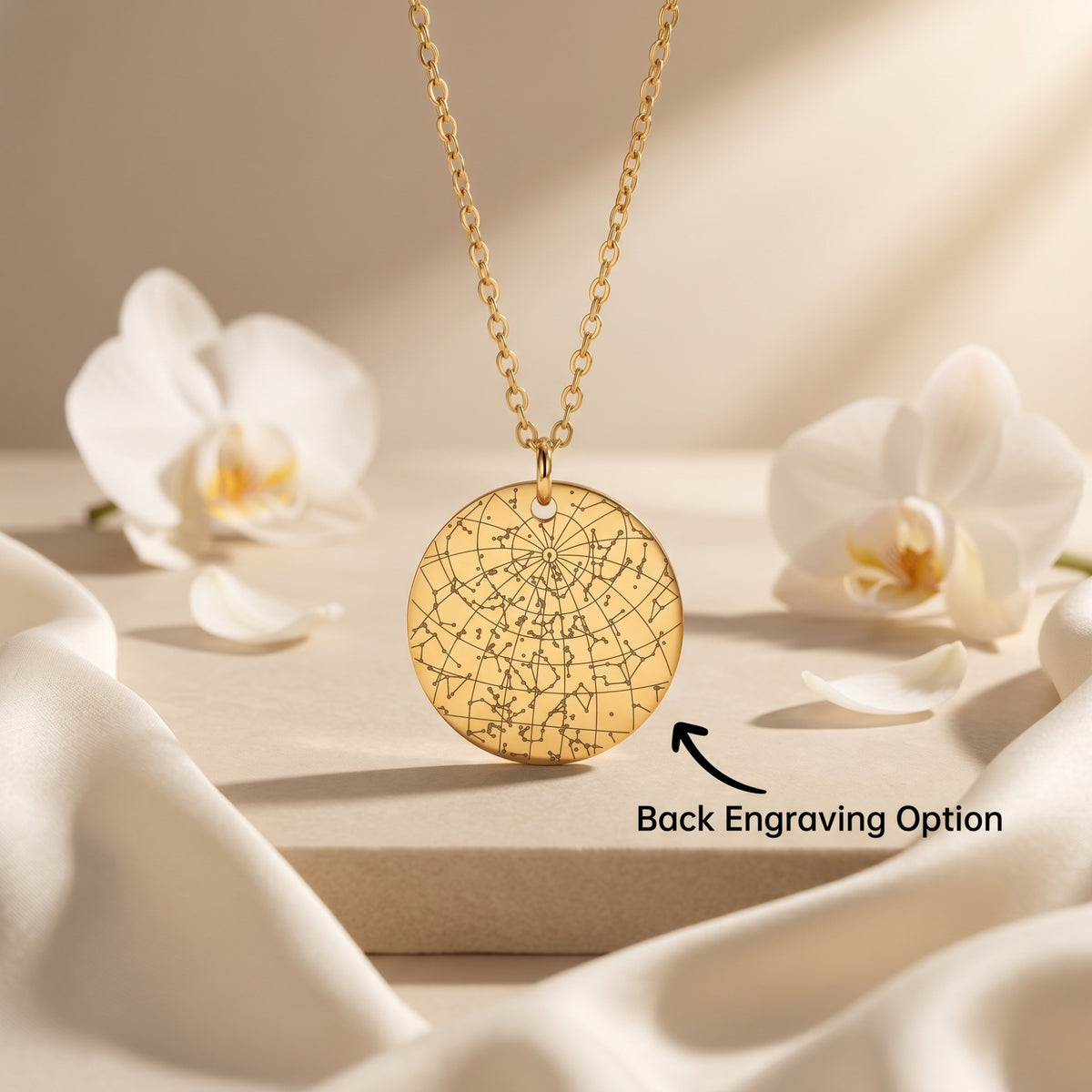 Gold stainless steel Constellara necklace with star map engraving and white orchids.