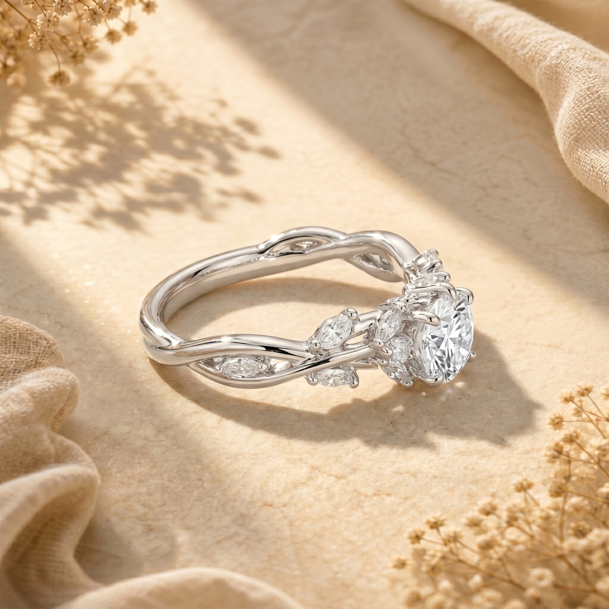 Angled side view of the silver Calyxta moissanite ring showcasing the intricate vine band and setting.