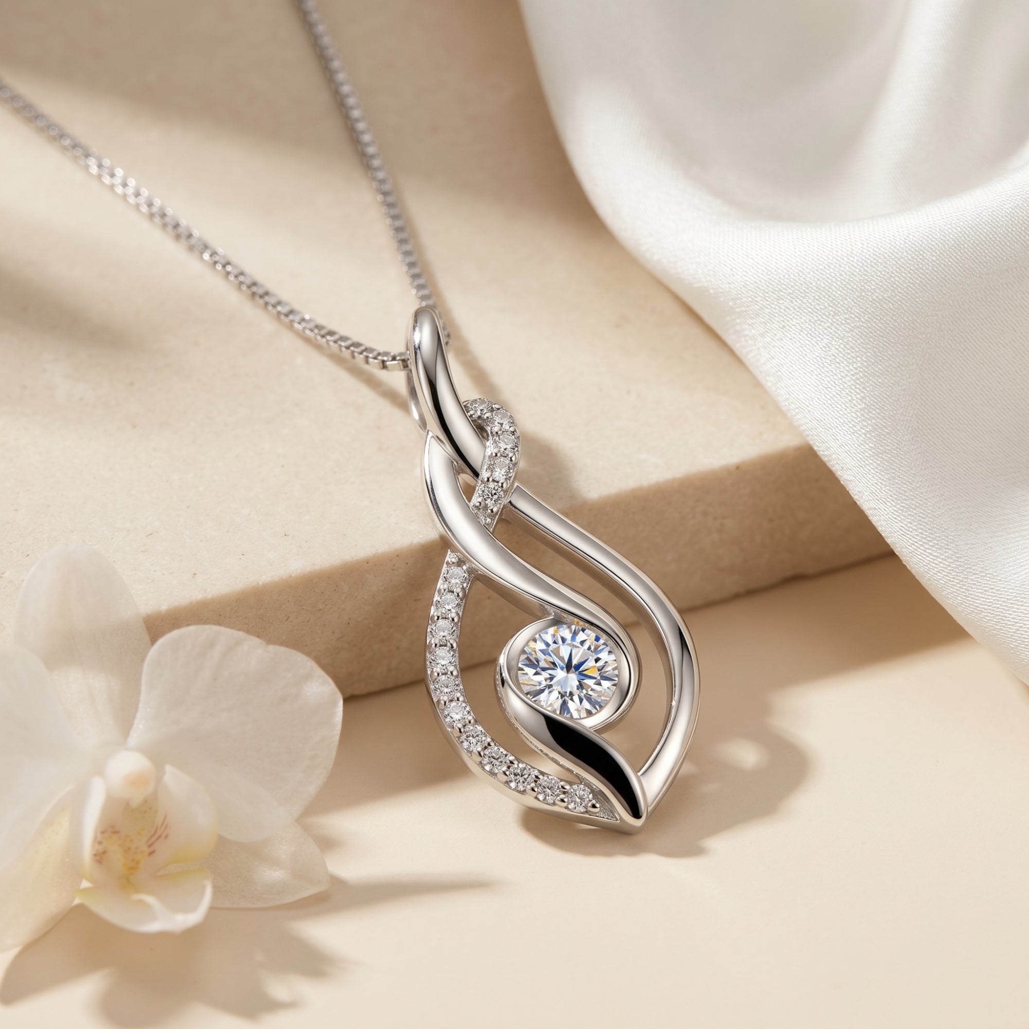 Macro detail shot of a moissanite pendant with a round-cut stone.