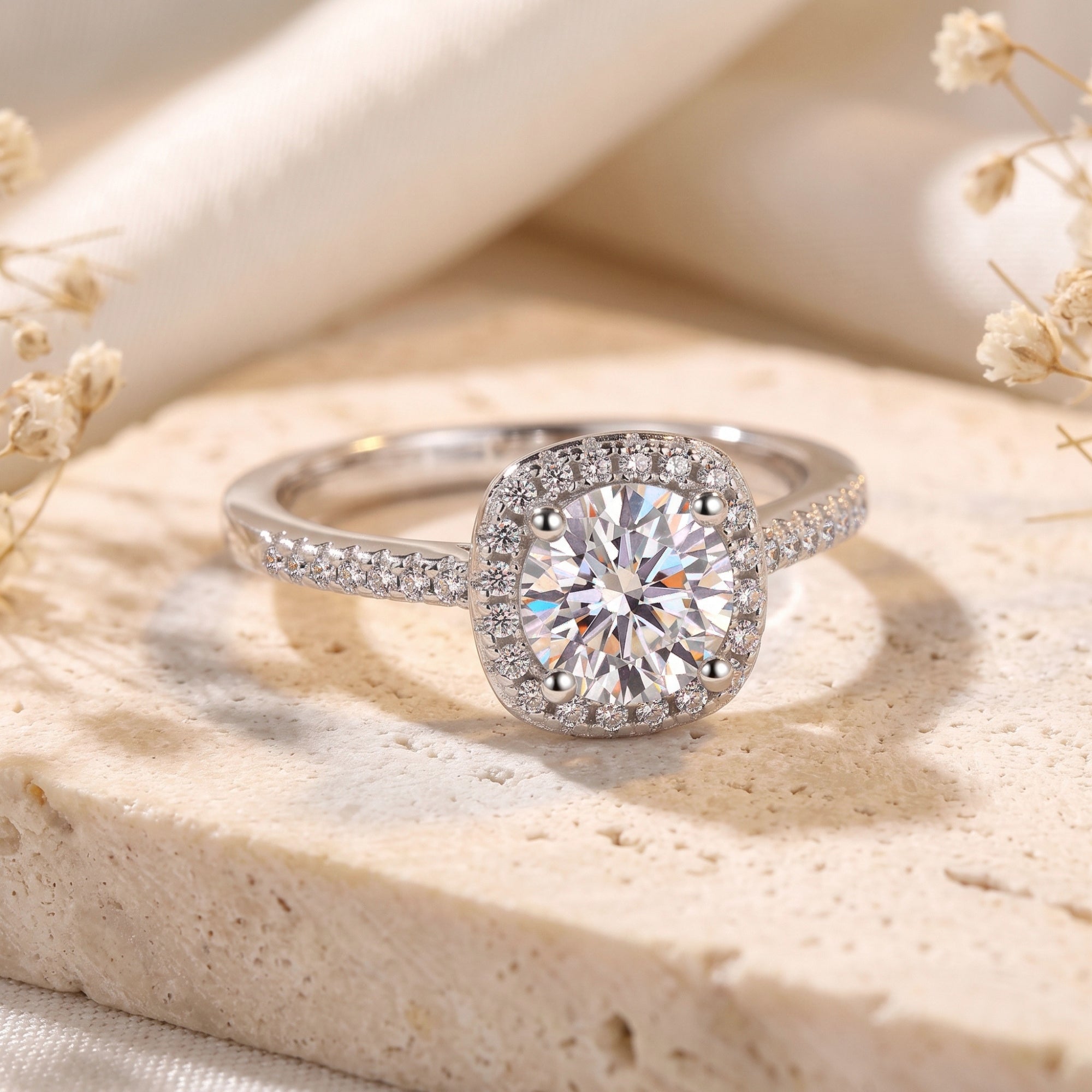 Three-quarter view of the Elianessa round cut simulated diamond halo ring in silver S925 sterling silver on stone.