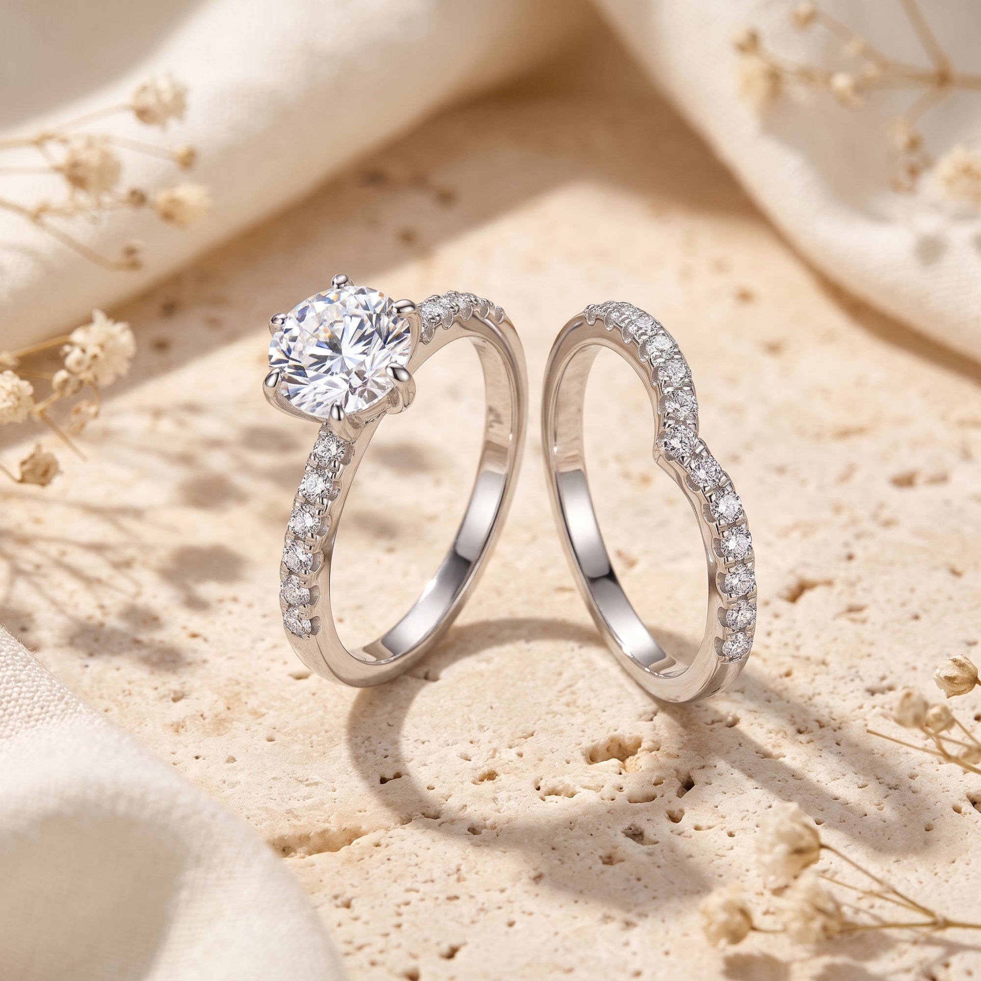 Separate silver solitaire ring and curved pavé band with round simulated diamond on stone.