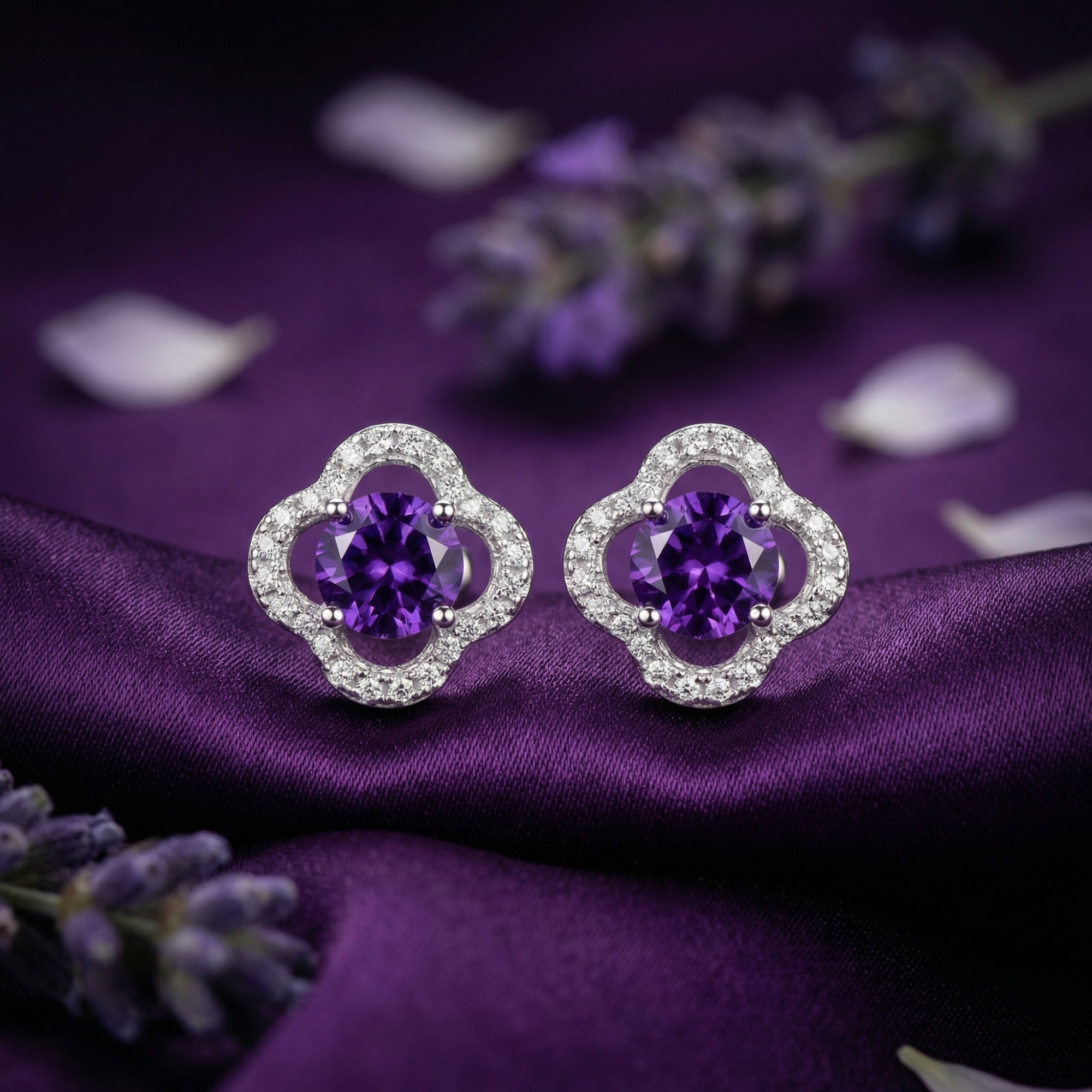 Macro view of round cut natural amethyst stud earrings in S925 sterling silver quatrefoil halo settings.