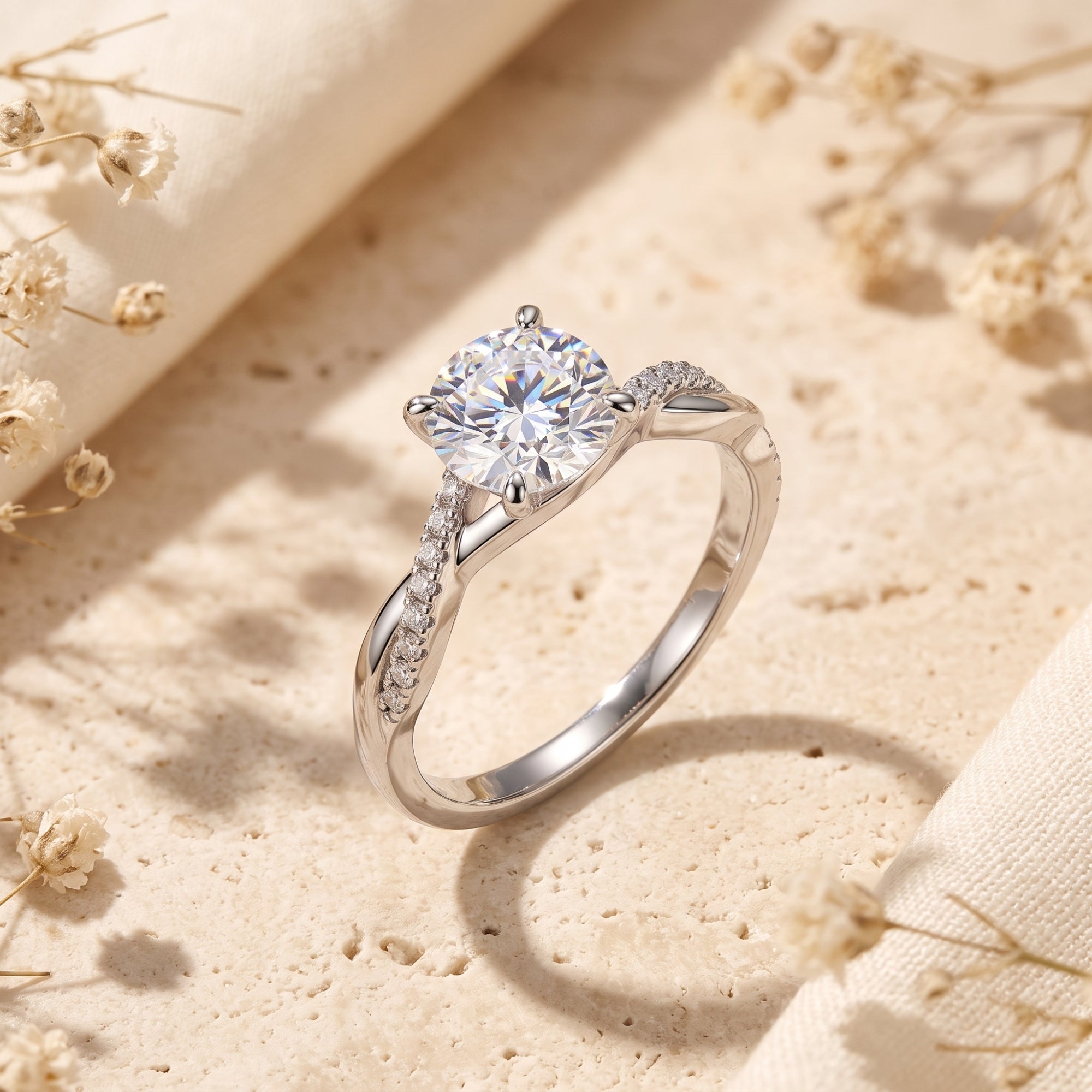 Angled view of a round-cut simulated diamond solitaire ring in S925 sterling silver with a twisted pavé band.
