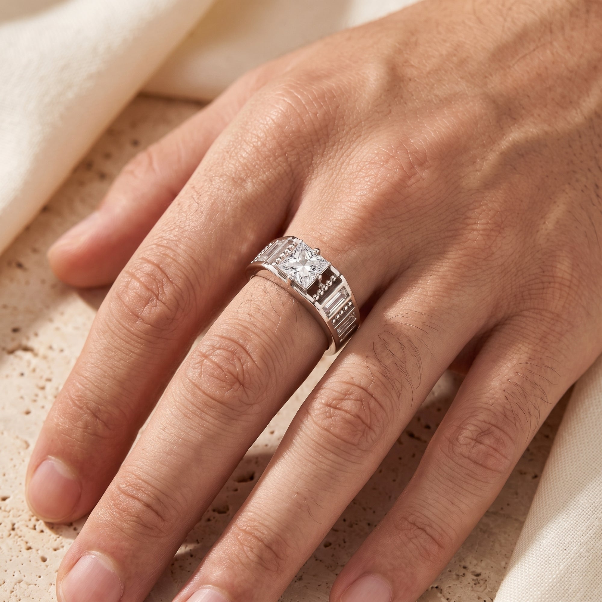 Top-down view of the Carisara silver promise ring with a princess cut simulated diamond worn on a finger.