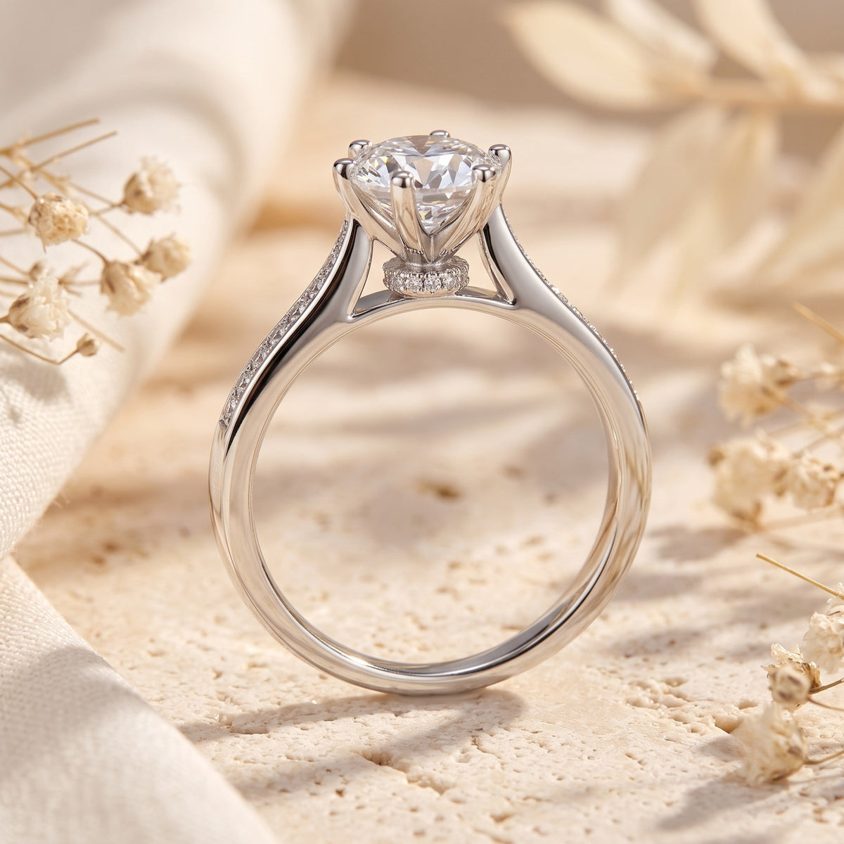 Side profile view showing the elevated cathedral setting, small pavé collar, and band on a silver ring.