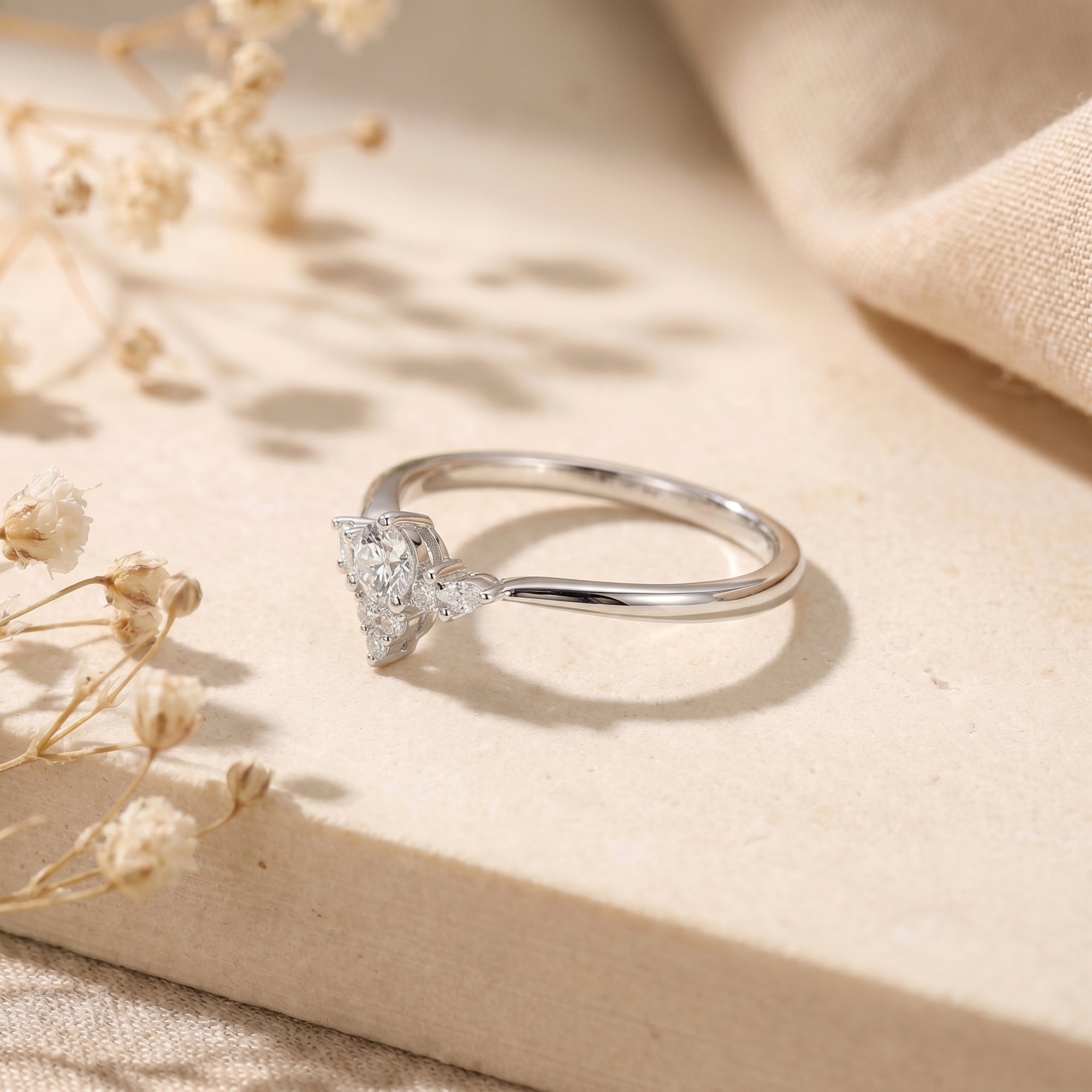 Side view of the silver Lysianna ring showing the vintage-inspired simulated diamond floral cluster setting.