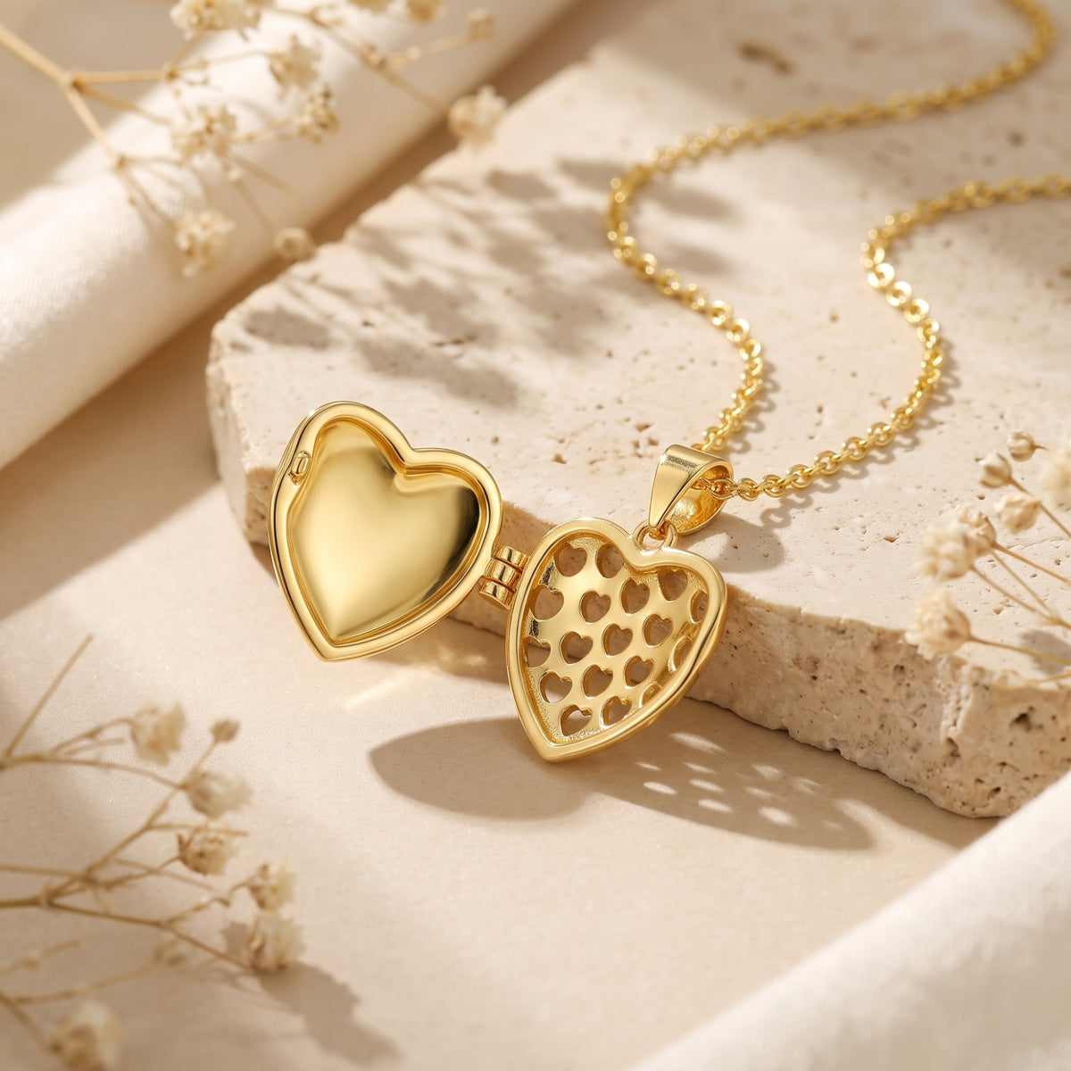 Open gold-tone ribbed heart locket revealing a smooth interior and a heart cut-out pattern.