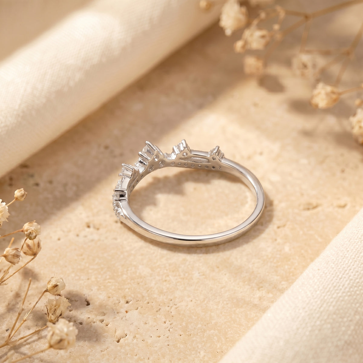 Side profile of the silver Ismerelle tiara ring showing the intricate setting and simulated diamonds.