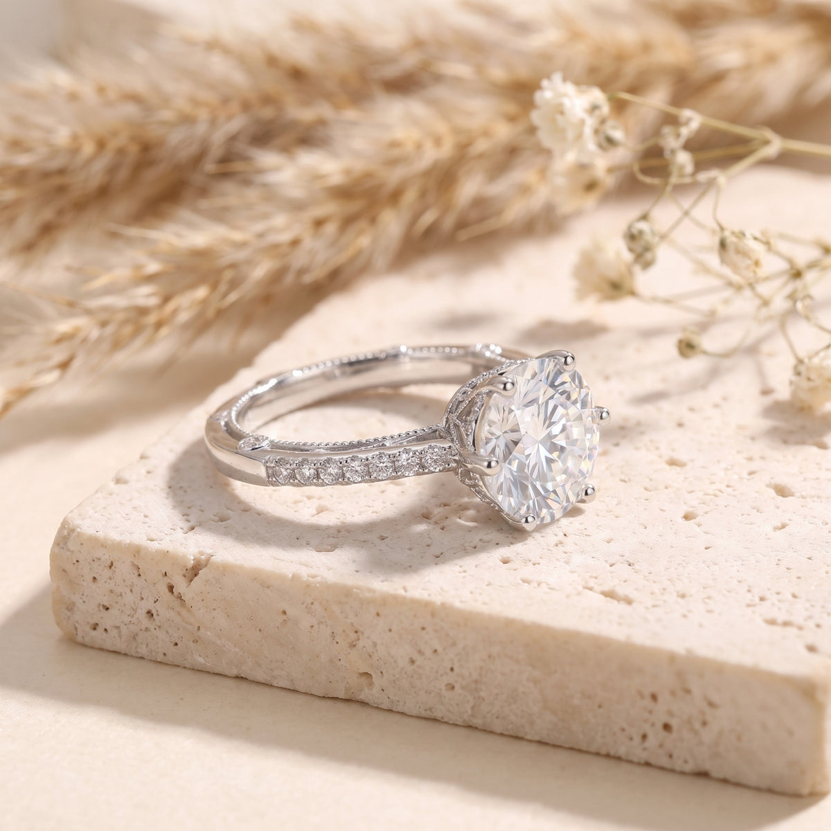 Side profile of the sterling silver Kalisene ring showing the 9mm round CZ and pavé-set band details.