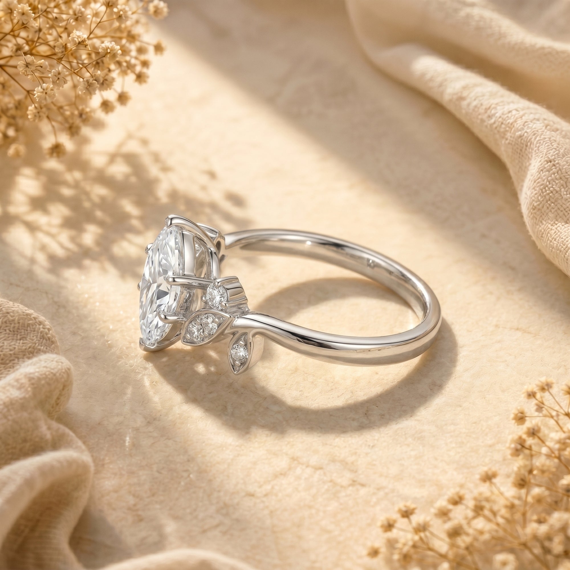 Profile view of marquise moissanite silver ring showing the leaf-inspired setting.
