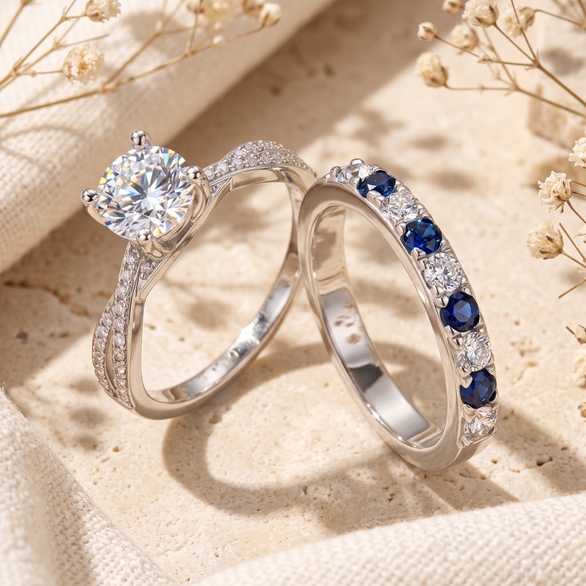 Close-up of Fiona silver rings featuring a round-cut solitaire and alternating blue stone band.