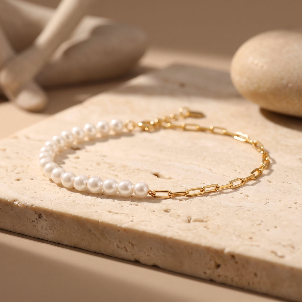 Close-up of the solid gold O-chain and round white pearls on the Lenora bracelet.