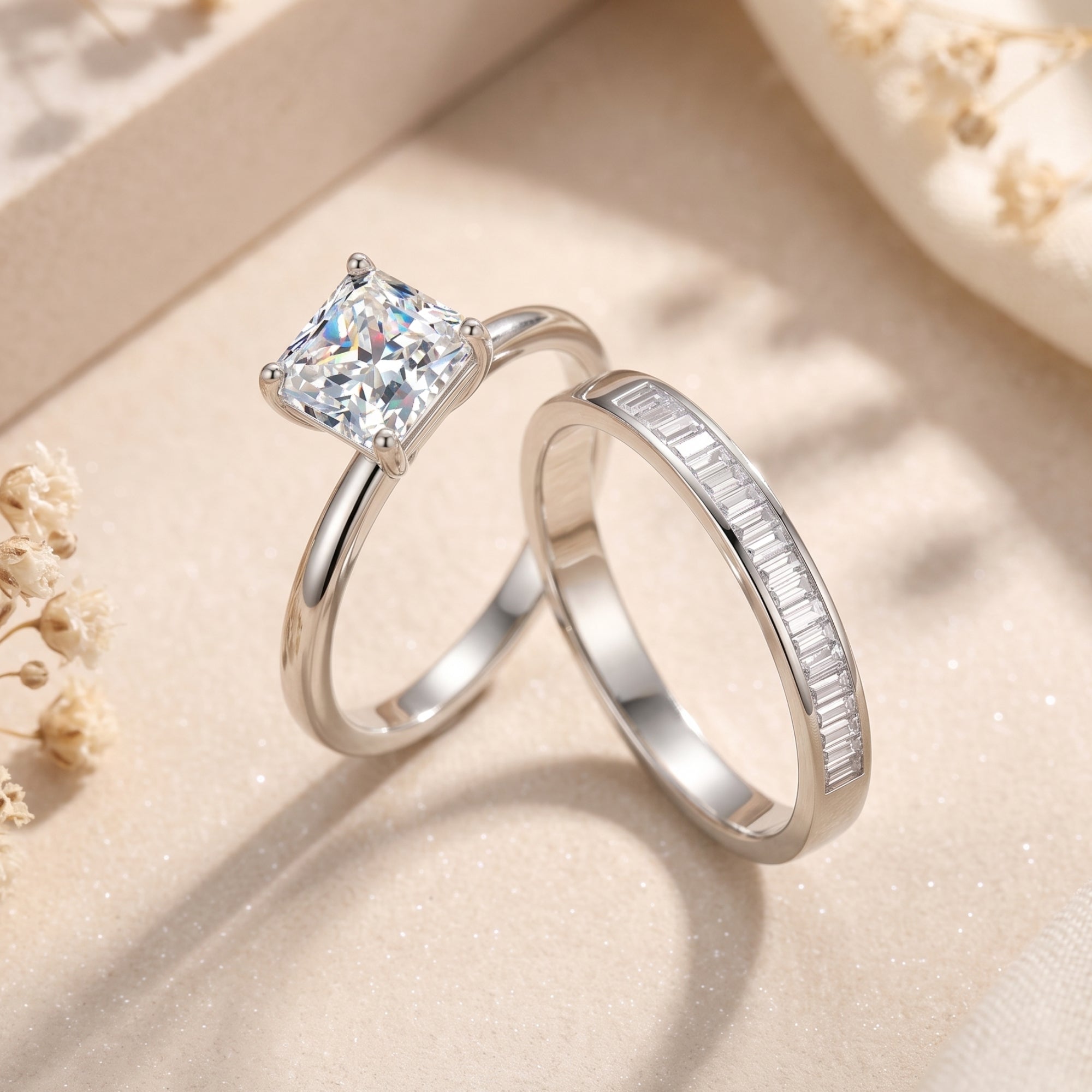 Side view of the silver Liorienne square-cut ring and baguette-set eternity band on a neutral styled background.