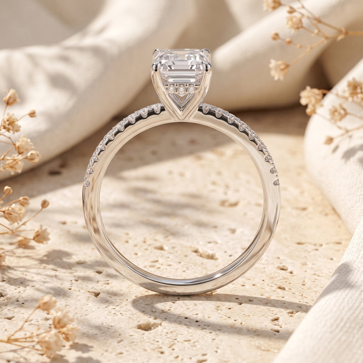 Profile view of the Selyndra sterling silver ring showing the emerald-cut stone setting and pavé band.