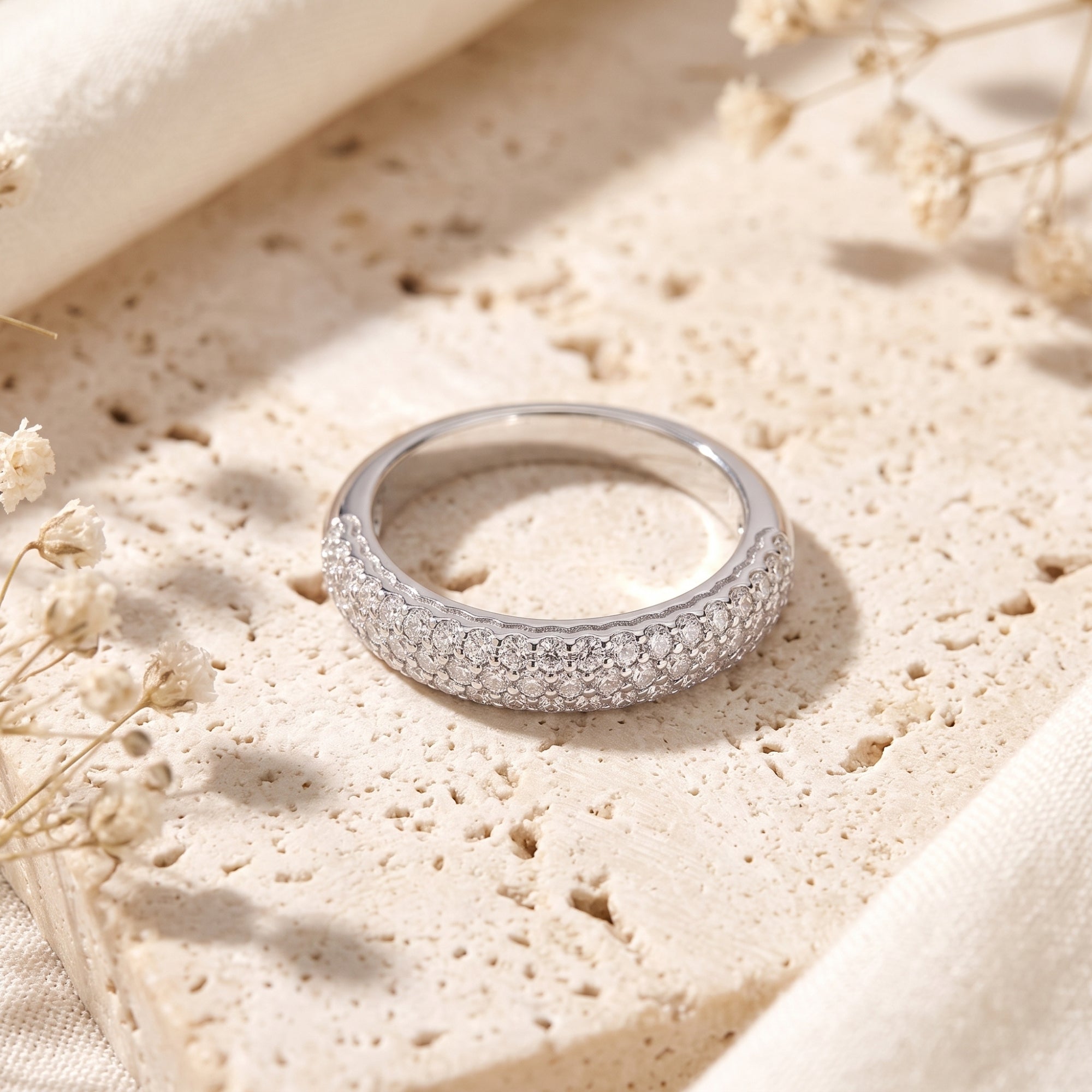 Close-up of the Florentina silver ring showing detailed hand-set simulated diamond rows on a stone base.